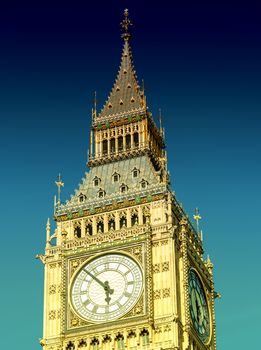 Big Ben Tower in London against blue sky.