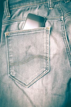 smart phone in jean pocket pants retro vintage style