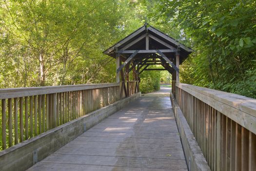 Small wooden covered bridge in Fairview Village Oregon.