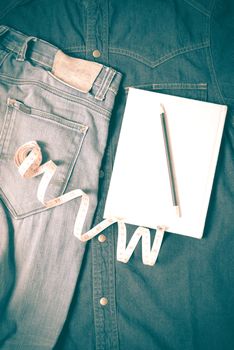 measuring tape and notebook with jean retro vintage style