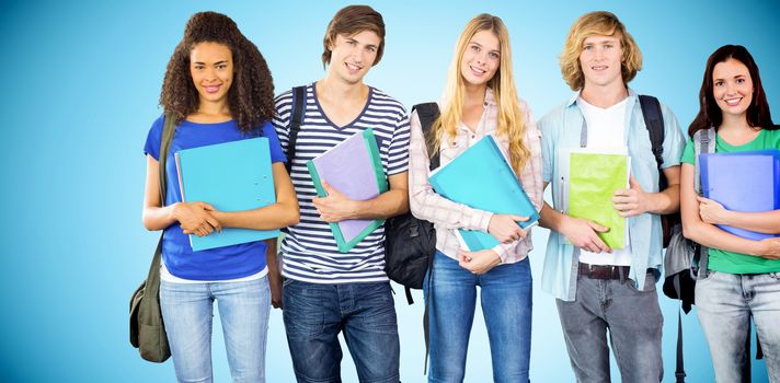 Happy college students holding folders against blue background with vignette