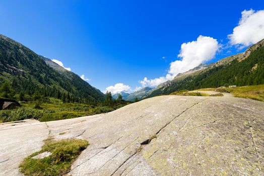 Mountain trail and peaks in the National Park of Adamello Brenta. Trentino Alto Adige, Italy