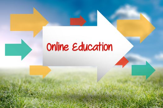 The word online education and arrow against sunny landscape