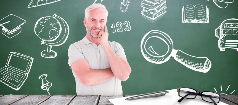 Mature student smiling  against green chalkboard