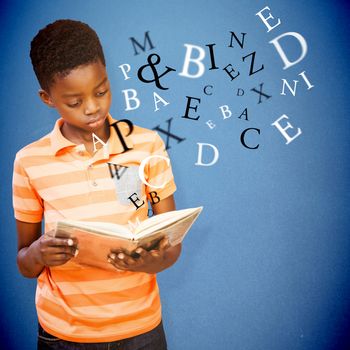 Cute boy reading book in library against blue background