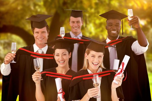 Group of people Graduating from College against trees and meadow in the park