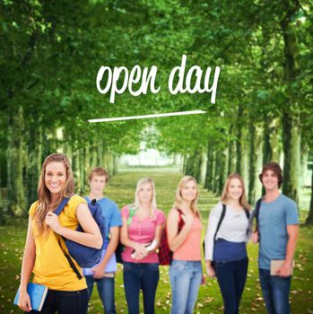 The word open day and a woman standing in front of his friends as she smiles against walkway along lined trees in the park