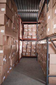 Rows of shelves with boxes in warehouse