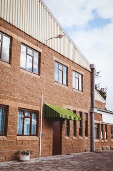 Exterior shot of a warehouse against the sky