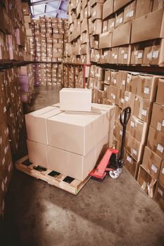 Storage cart on floor with boxes in warehouse 