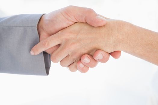 Close up of business people shaking hands 