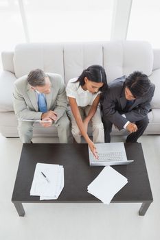 Business team working together with laptop in the office