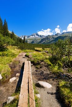 Mountain trail and peaks (Care Alto Peak) in the National Park of Adamello Brenta. Trentino Alto Adige, Italy