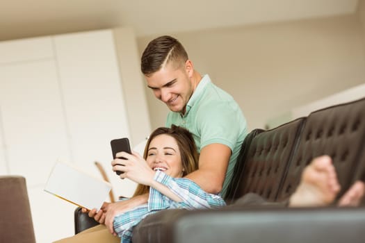 Cute couple relaxing on couch at home in the living room