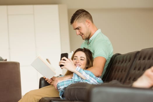 Cute couple relaxing on couch at home in the living room