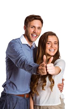 Portrait of happy young couple gesturing thumbs up over white background