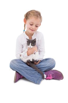 Little girl sitting with cat in her arms on white background