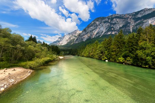 The green Gail River the largest tributary of the Drava River. Carinthia, Austria