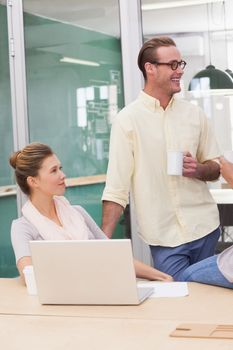 Smiling team of business people having a meeting in the office