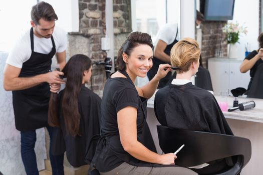 Hairdressers working on their clients at the hair salon