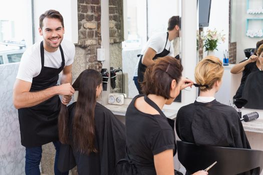 Hairdressers working on their clients at the hair salon