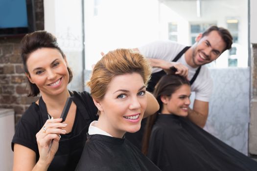 Hairdressers working on their clients at the hair salon