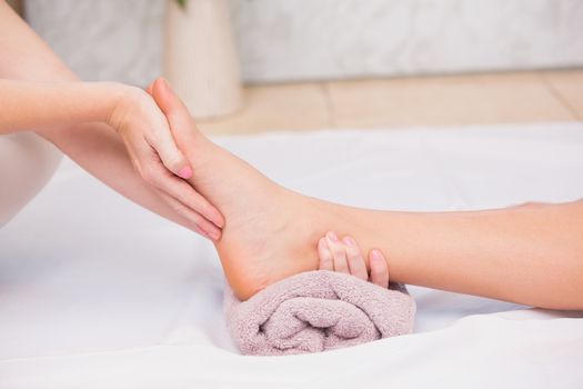 Woman receiving a foot massage at the beauty salon