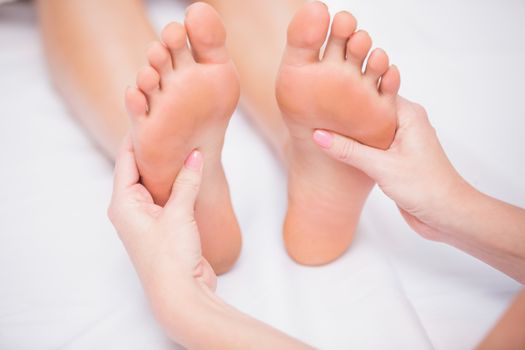 Woman receiving a foot massage at the beauty salon