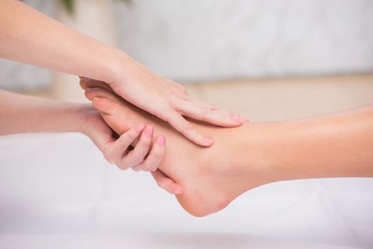 Woman receiving a foot massage at the beauty salon