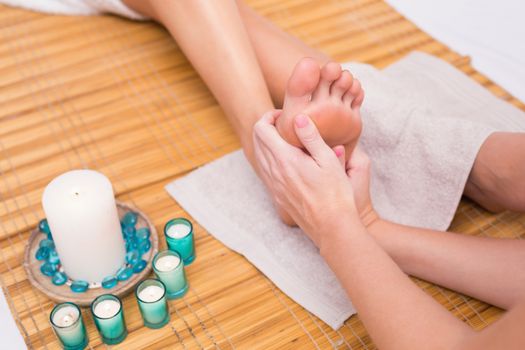 Woman receiving a foot massage at the beauty salon