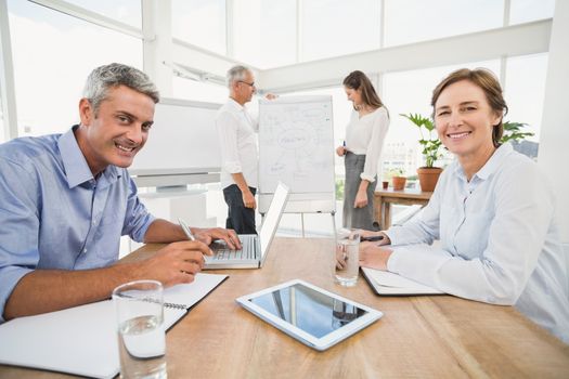 Portrait of smiling business people having a meeting in the office