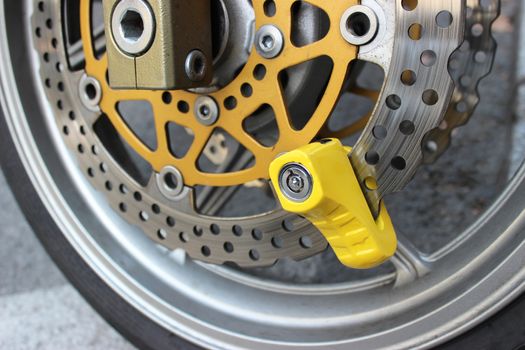 Yellow Disc Lock on Motorbike Disc Brake
