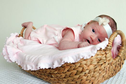 Closeup of newborn baby in basket
