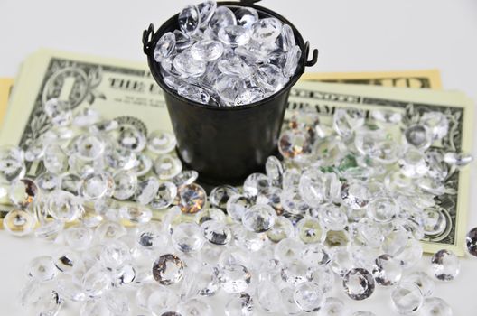 US Dollars covered with diamonds and bucket