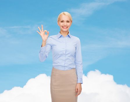 business and education concept - smiling businesswoman showing ok-sign with hand