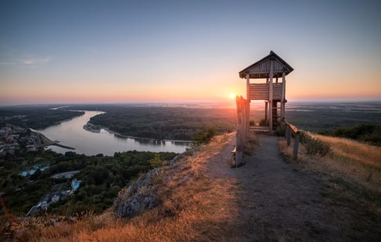 Wooden Tourist Observation Tower above a Little City of Hainburg an der Donau with Danube River at Beautiful Sunset