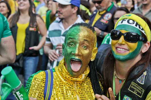 SAO PAULO, BRAZIL August 16, 2015: Two unidentified women  in the protest against federal government corruption in Sao Paulo Brazil.