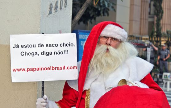SAO PAULO, BRAZIL August 16, 2015: An unidentified man with the Santa Clau costume in the protest against federal government corruption in Sao Paulo Brazil.