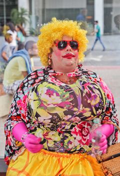 SAO PAULO, BRAZIL August 16, 2015: An unidentified man with Drag Queen costume in the protest against federal government corruption in Sao Paulo Brazil.