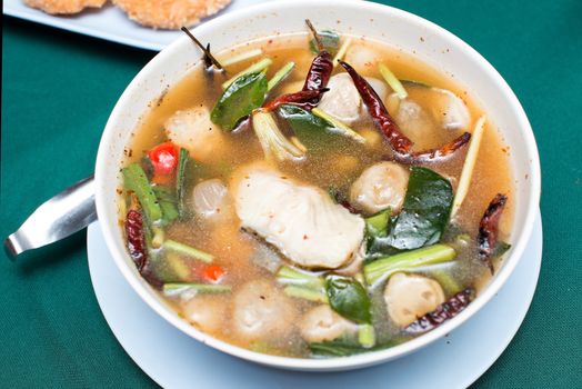 tom yum soup ,Thai style Spicy soup with fish- Local Thai food : Tom Yum (spicy lemongrass soup) with striped snakehead fish