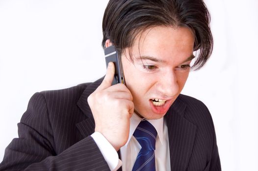 Business cellphone conversation. A businessman at odds over the mobilephone.