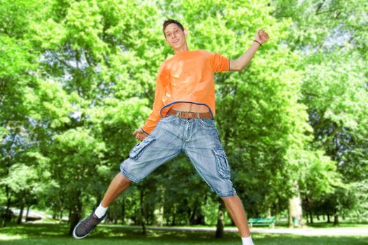 Emotions conceptual image. Young man jump and laugs.