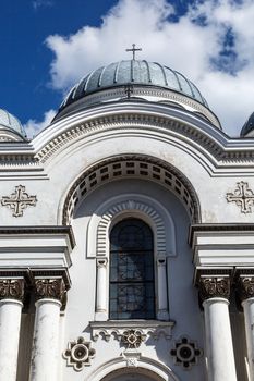 Close up view of catholic roman church named St Micheal the Archangel in Kaunas, on cloudy blue sky background.