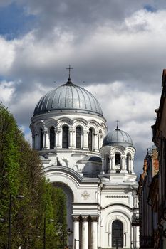 Front view of catholic roman church named St Micheal the Archangel in Kaunas, on cloudy blue sky background.