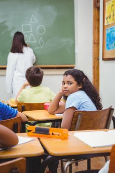 Bored student looking away from board at the elementary school