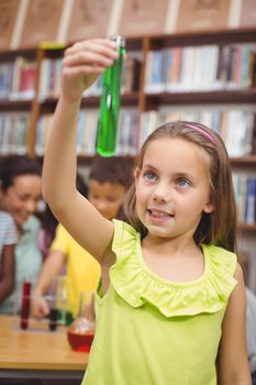Pupil doing science in library at the elementary school