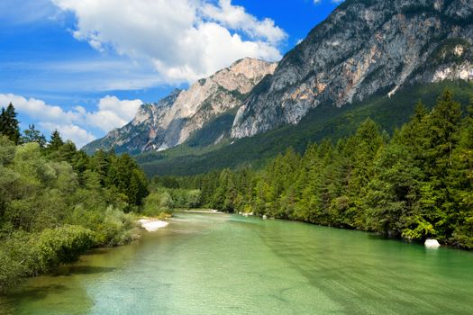 The green Gail River the largest tributary of the Drava River. Carinthia, Austria