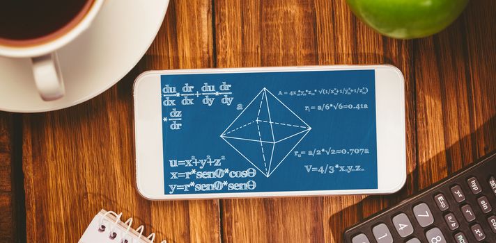 Math problems against smartphone on desk