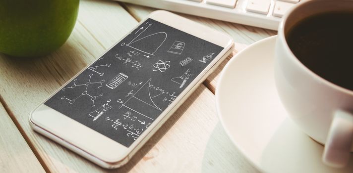 Math and science doodles against smartphone on desk