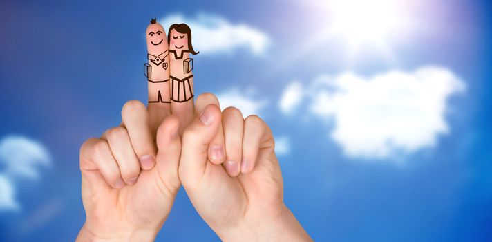 Fingers posed as students against bright blue sky with clouds